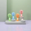 Mini handheld colorful small fan, a portable handheld cooling electric fan for student dormitories outdoors Application Scenario